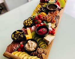 Beautiful grazing table setup with artisanal cheeses, charcuterie and gourmet accompaniments - Twisted Flour & Sugar catering Christchurch